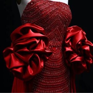 Elegant Red Dress with Dramatic Sleeves
